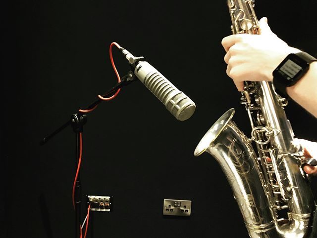 Saxophone at the microphone in the studio